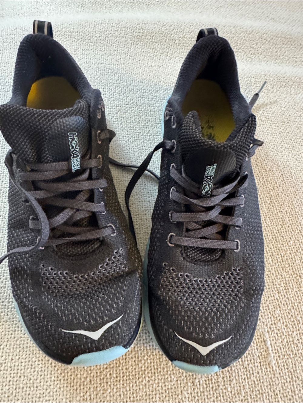 Hoka One One woman’s Black with Light Blue Accent Athletic Shoes size 10